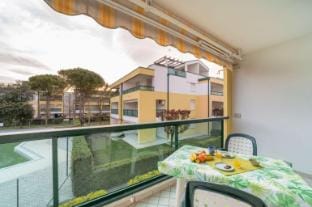 Beachfront flat with shared pool in Bibione Apartment in Bibione
