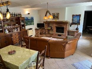 typical farmhouse with a wood-burning fireplace Apartment in Piedmont