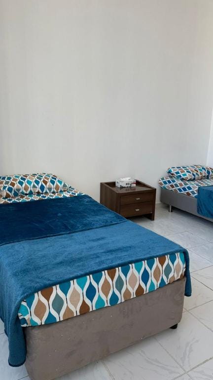 single bed in shared room - سرير مفرد في شقة فندقي Hotel in Al Sharjah