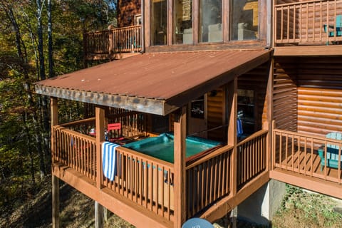 Covered hot tub and multiple balconies.