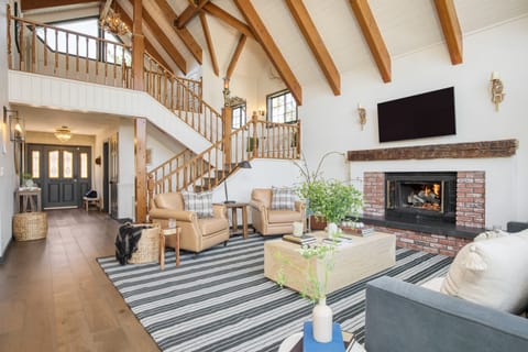 Spacious and bright main living area features high ceilings.