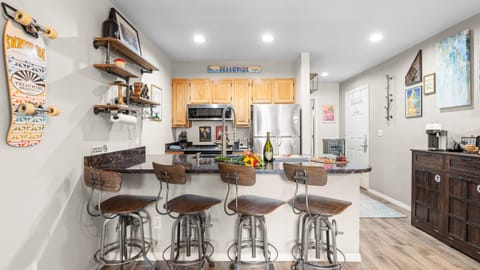 Inviting bar-style kitchen perfect for morning coffee or evening wine.