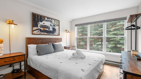 The bedroom features a California king bed.