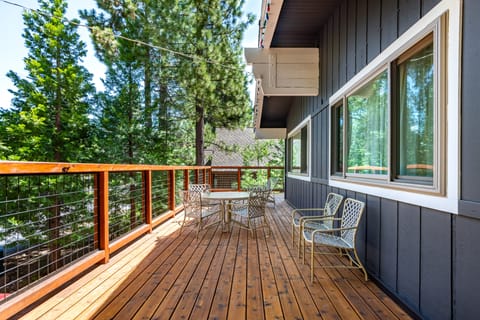 Deck with seating and round table.