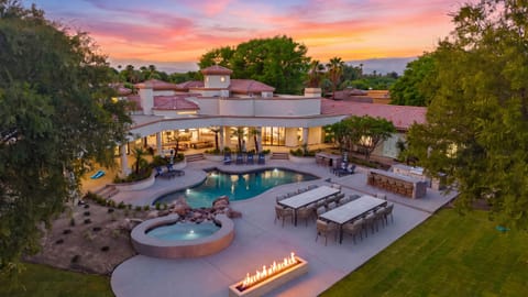 Twilight reveals Villa Verbena’s resort-style pool, spa, and glowing outdoor gathering spaces.
