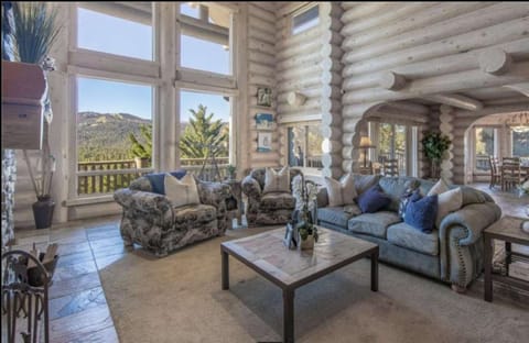 Beautiful living room with floor to ceiling windows.