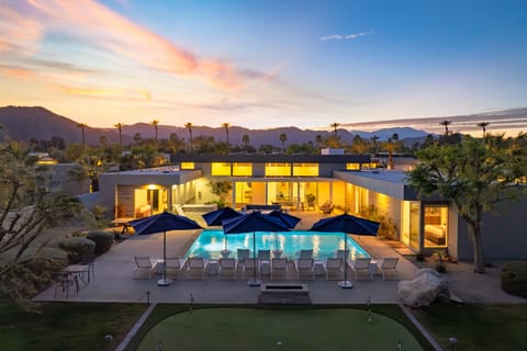 Unwind in the expansive pool & spa area, complete with a fire pit.