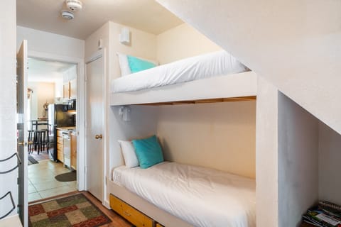 Additional built-in bunk beds near the kitchen for extra sleeping space — perfect for children!