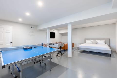 Game room with a ping-pong table and foosball table. (Dudley II)