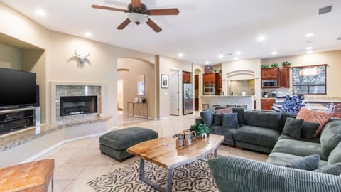 The living area features a fireplace and a TV.
