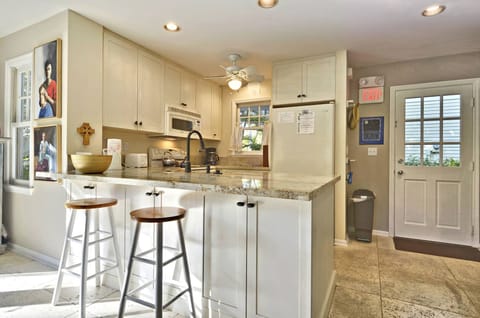 Kitchen features a breakfast bar.