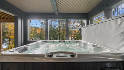 Hot tub with lake views.