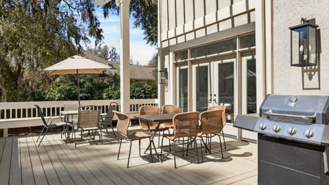 Large deck with BBQ grill and al fresco dining table perfect for outdoor fun.
