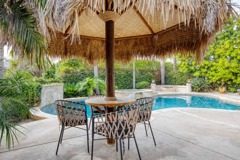 Outdoor dining table with umbrella.