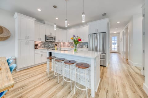 Spacious kitchen with barstool seating at the island.