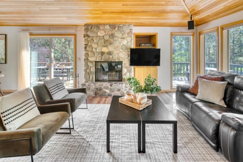 Modern living area boasts a fireplace and TV.
