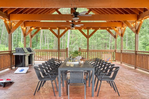 The huge outdoor pavilion is perfect for hosting events, with a table that sits 10, a grill, and lighting for when the sun goes down.