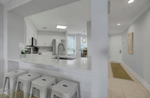 Kitchen with breakfast bar seating.