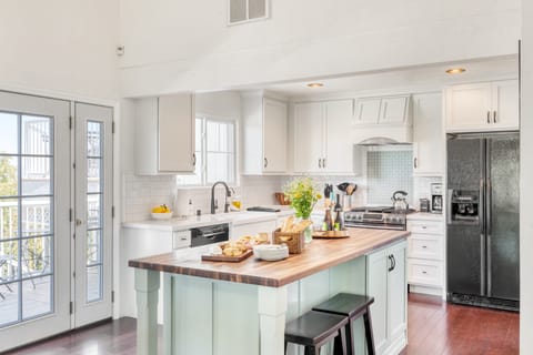 Covered section of the patio features a private hot tub.