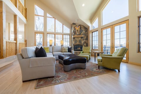 Huge windows offer panoramic mountain views from the living room.