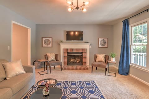 The decorative fireplace has since been replaced with a remote-controlled electric fireplace available for guest use.