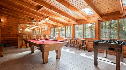 Game room features a pool table and sports bar.