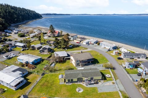 An elevated perspective of the house showcasing stunning vistas of the ocean