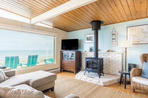Stay cozy by the fire and soak in the incredible ocean view.
