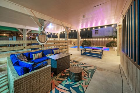 Relaxation meets luxury with this inviting couch by the pool.