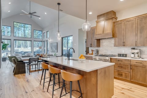 Fully equipped kitchen with barstool seating at the large island.