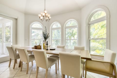Upscale dining area surrounded by windows.