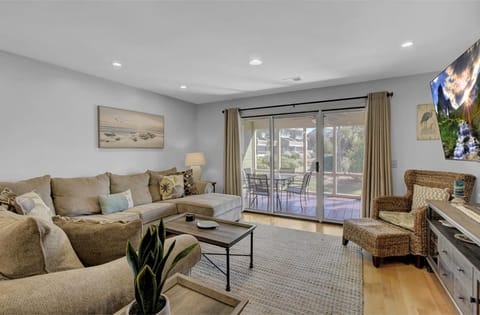 Chic and bright living room with direct access to patio.