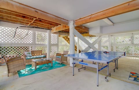 Garage room with ping pong table.