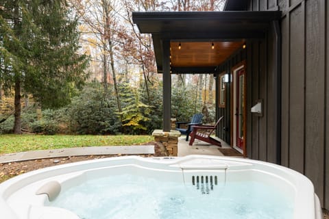 Relax and unwind in the private hot tub.