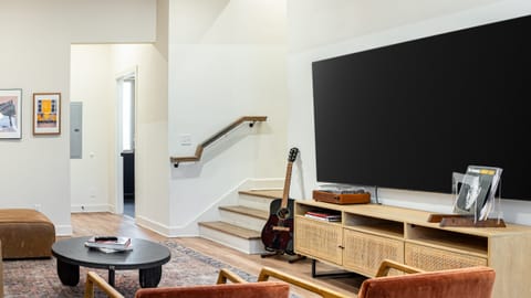 Main living area features ample seating and a flat-screen TV.