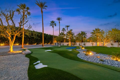 Pool table surrounded by natural light indoors.