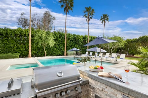 Chef's kitchen with barstool seating.