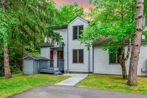 This wooden deck with a grill is the perfect place to relax and enjoy the outdoors.