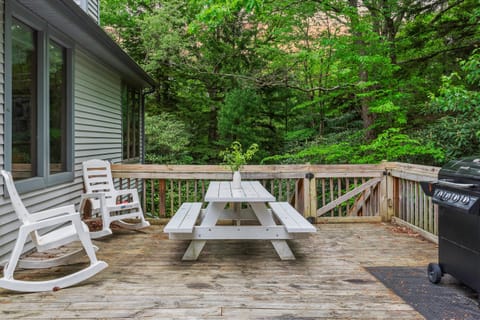 A living room with a comfy couch, and fireplace.