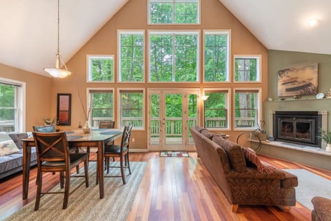 Expansive windows fill the space with natural light. Upgraded with a propane fireplace.
