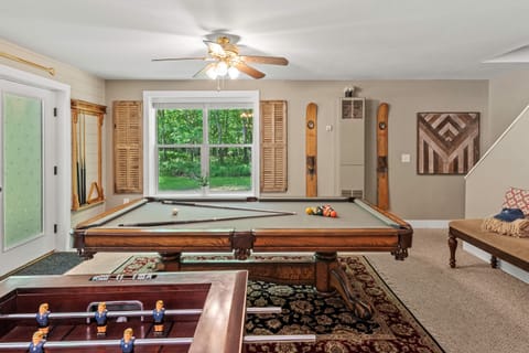 Shoot some pool, play foosball, or grab a drink at the bar - this game room has it all!