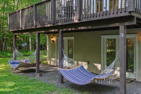 Create your own backyard oasis with these two hammocks strung under the deck.