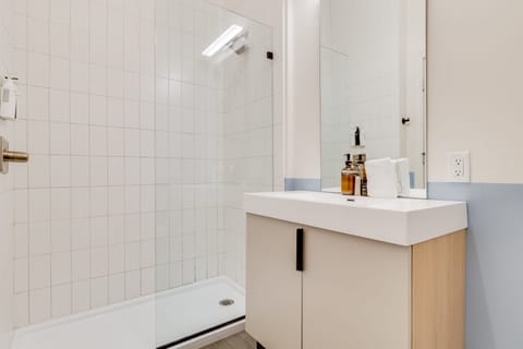 This bathroom features a walk-in shower.