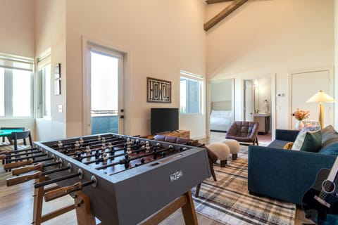 Living area features a foosball table.