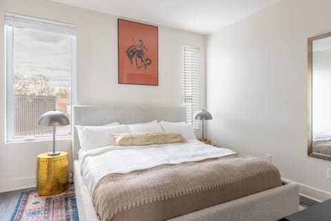 Four beautiful bedrooms, including one room with bunk beds.