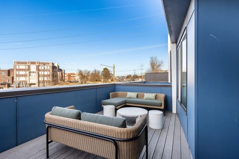 Private outdoor patio with comfortable lounge seating.