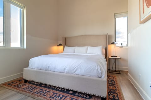 Bedroom 1 features a king bed and ensuite bathroom.