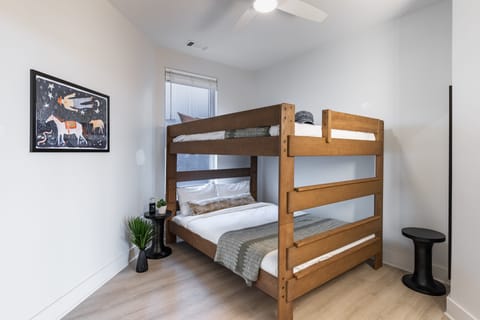 Bedroom 2 features a bunk queen bed.