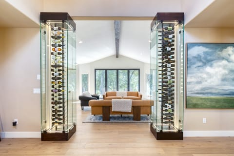 Wine enthusiasts will love the impressive wine displays in the formal living room.