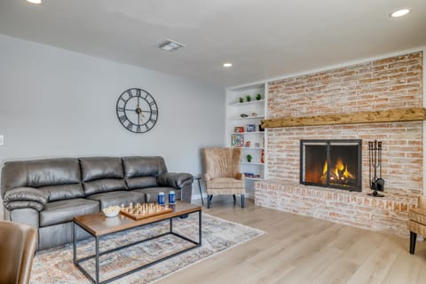 Warm and charming living room with a fireplace.